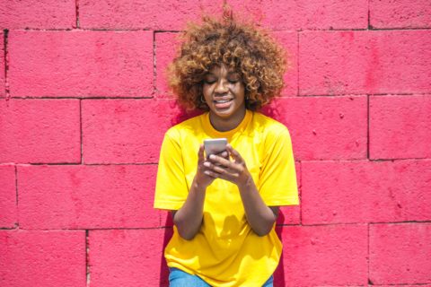 woman-in-yellow-shirt-holding-cellular-phone-3765114 (1)